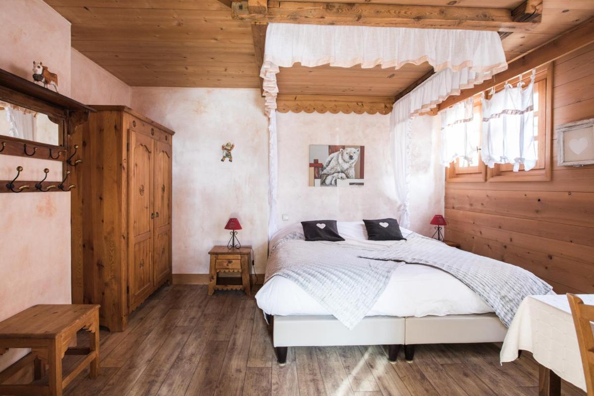 Un ou plusieurs lits dans un hébergement de l'établissement Les Chalets de La Griyotire