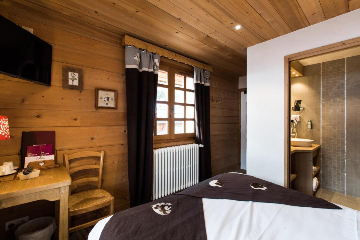 Un ou plusieurs lits dans un hébergement de l'établissement Les Chalets de La Griyotire