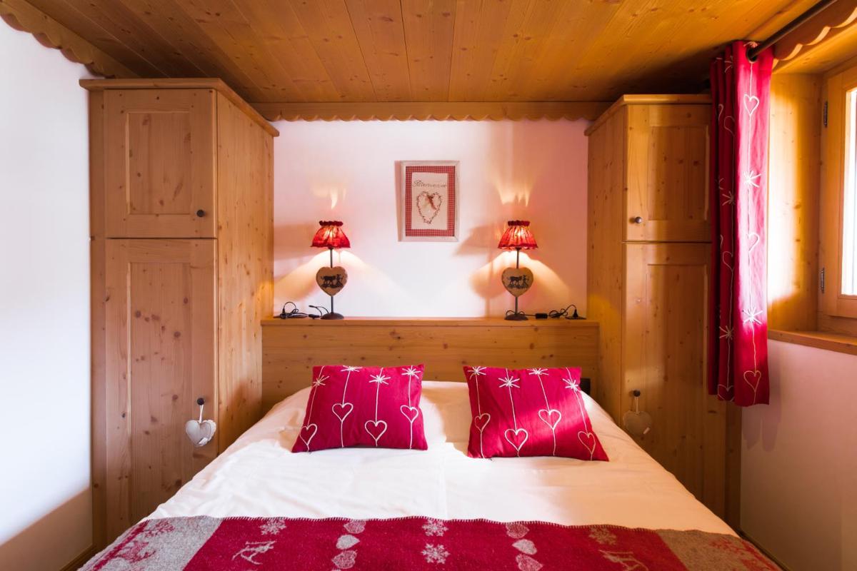 Un ou plusieurs lits dans un hébergement de l'établissement Les Chalets de La Griyotire