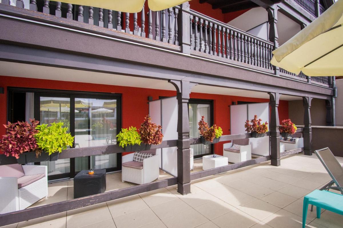 Balcon ou terrasse dans l'établissement Au Soleil, Hôtel Restaurant & Spa