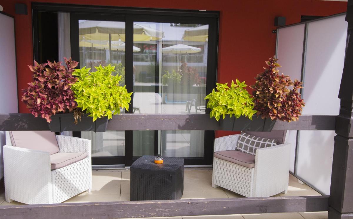 Coin salon dans l'établissement Au Soleil, Hôtel Restaurant & Spa
