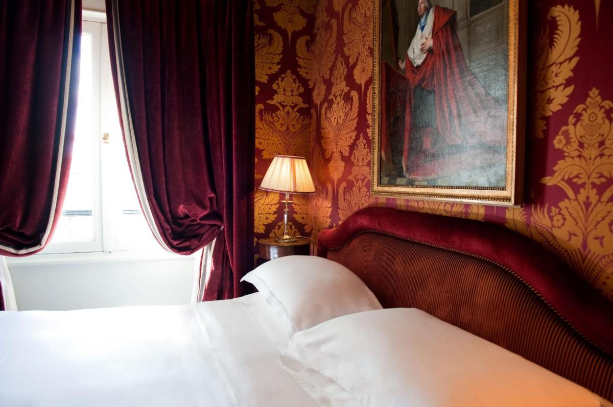 Un ou plusieurs lits dans un hébergement de l'établissement L'Hôtel