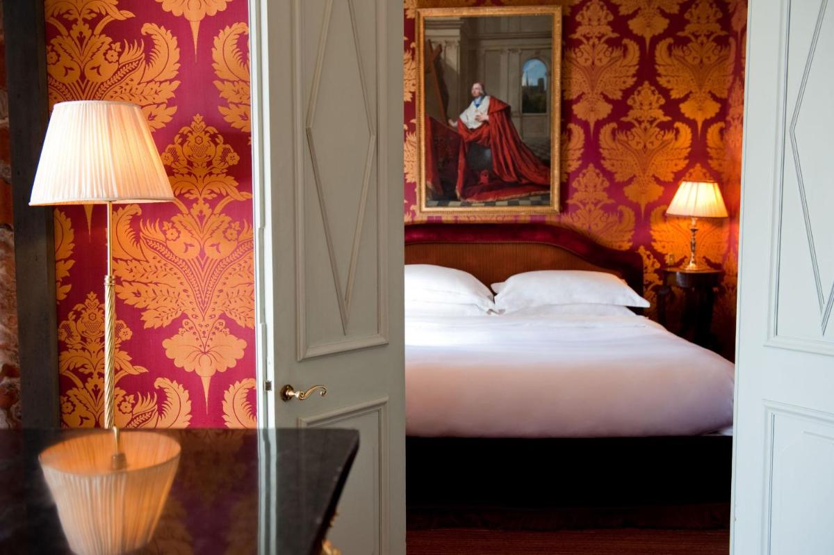 Un ou plusieurs lits dans un hébergement de l'établissement L'Hôtel