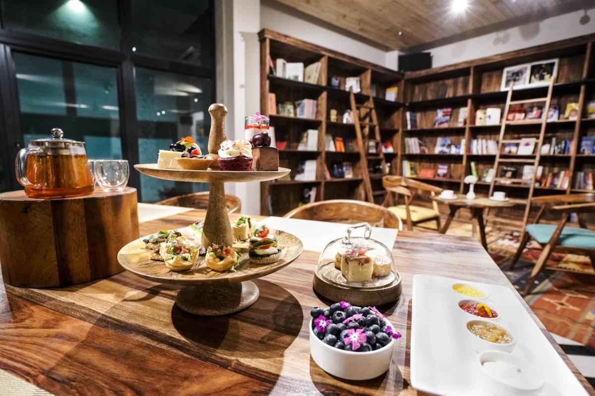 a table with three plates of food on it at Brij Nest, Jaipur - An All Suite Boutique Hotel in Jaipur