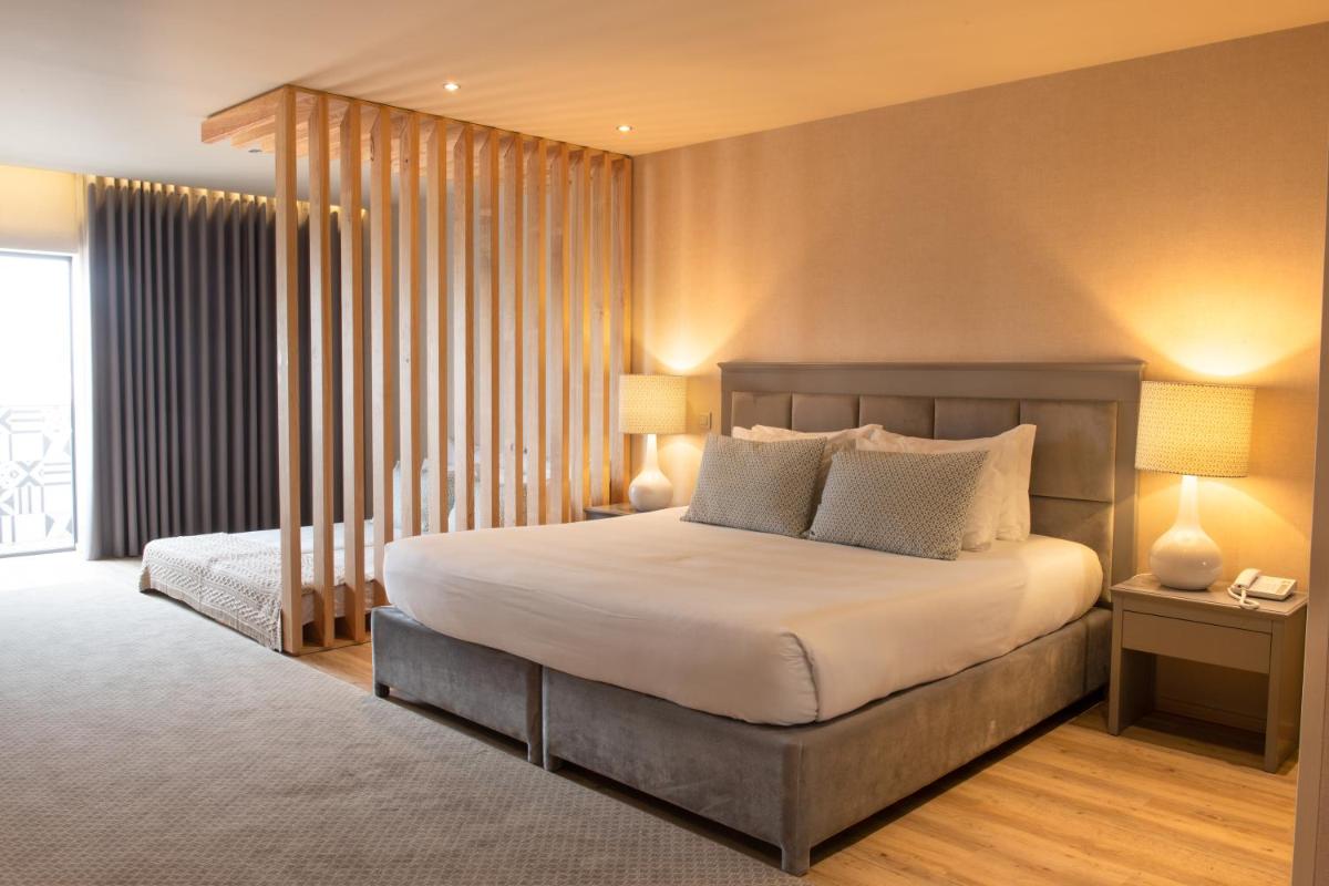 Uma cama ou camas num quarto em Hotel Cristal Vieira Praia & SPA