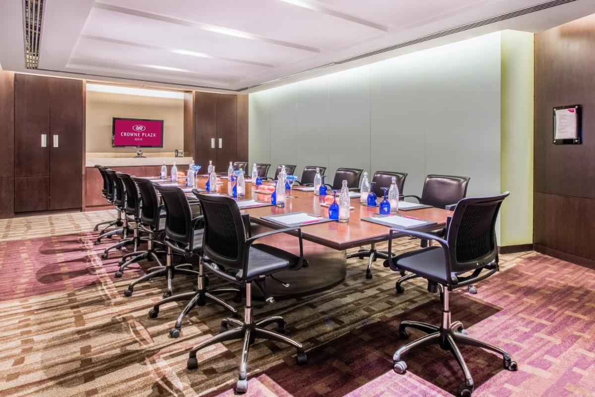 a conference room with a long table and chairs at Crowne Plaza Kochi by IHG in Cochin