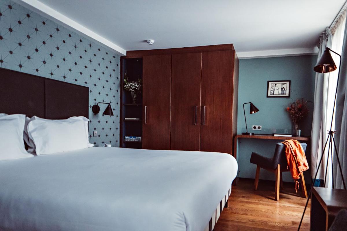 Un ou plusieurs lits dans un hébergement de l'établissement Monsieur Cadet Hotel & Spa