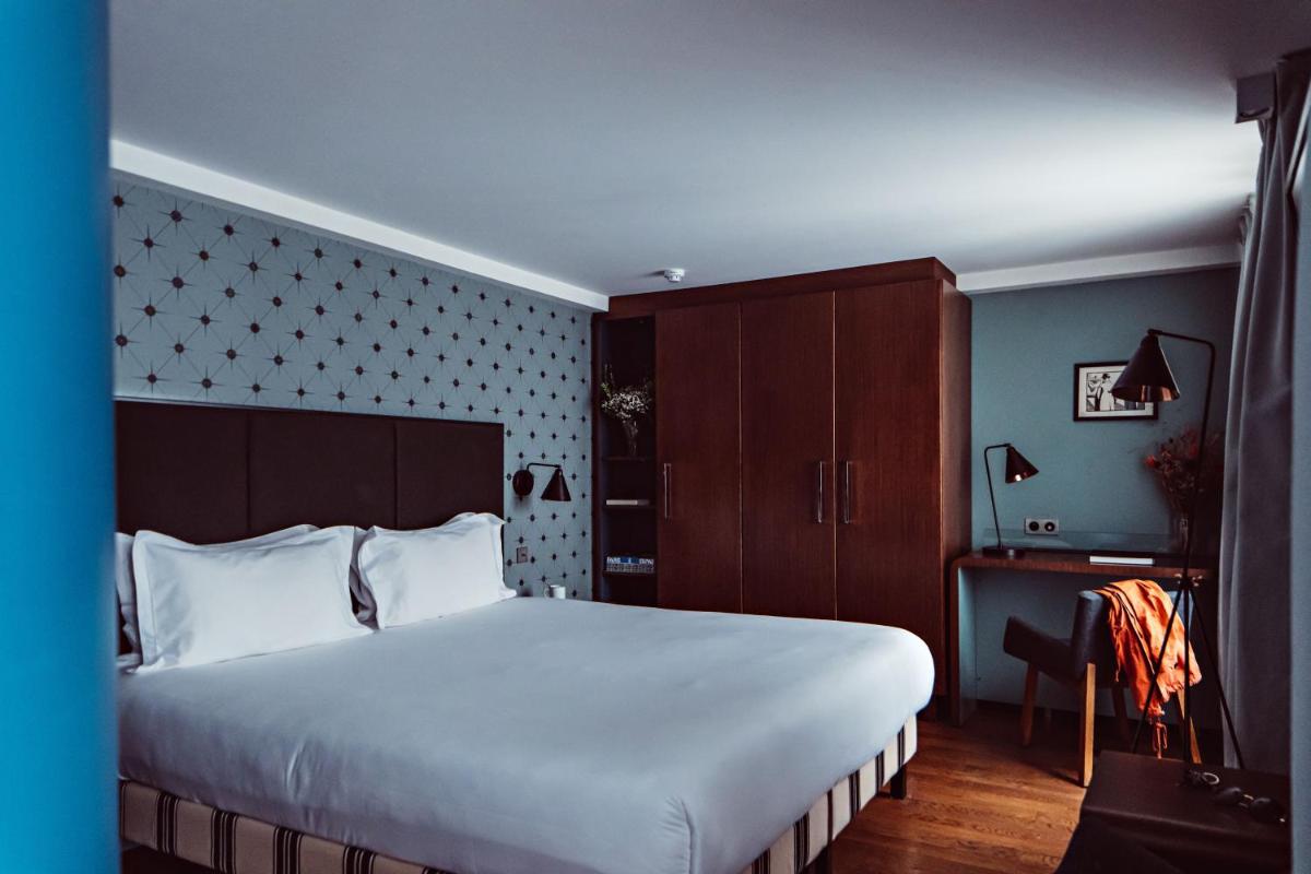 Un ou plusieurs lits dans un hébergement de l'établissement Monsieur Cadet Hotel & Spa