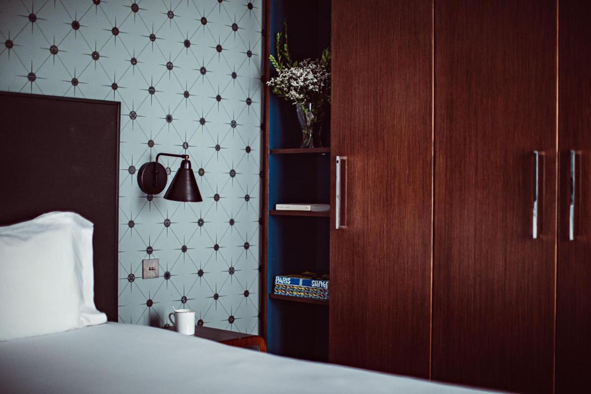 Un ou plusieurs lits dans un hébergement de l'établissement Monsieur Cadet Hotel & Spa