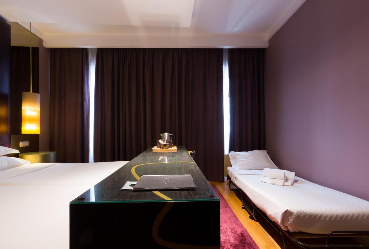 Uma cama ou camas num quarto em Hotel Meira