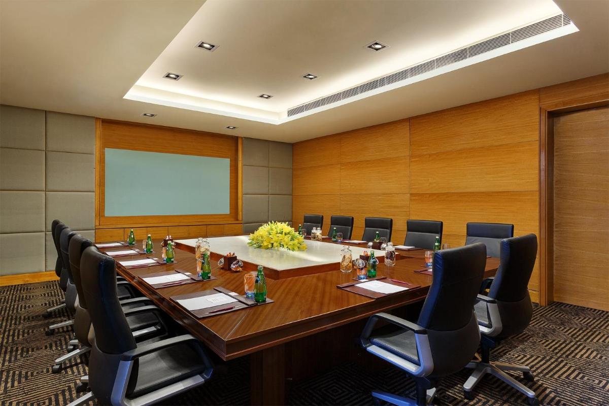 a large conference room with a long table and chairs at Crowne Plaza Today Gurugram by IHG in Gurgaon