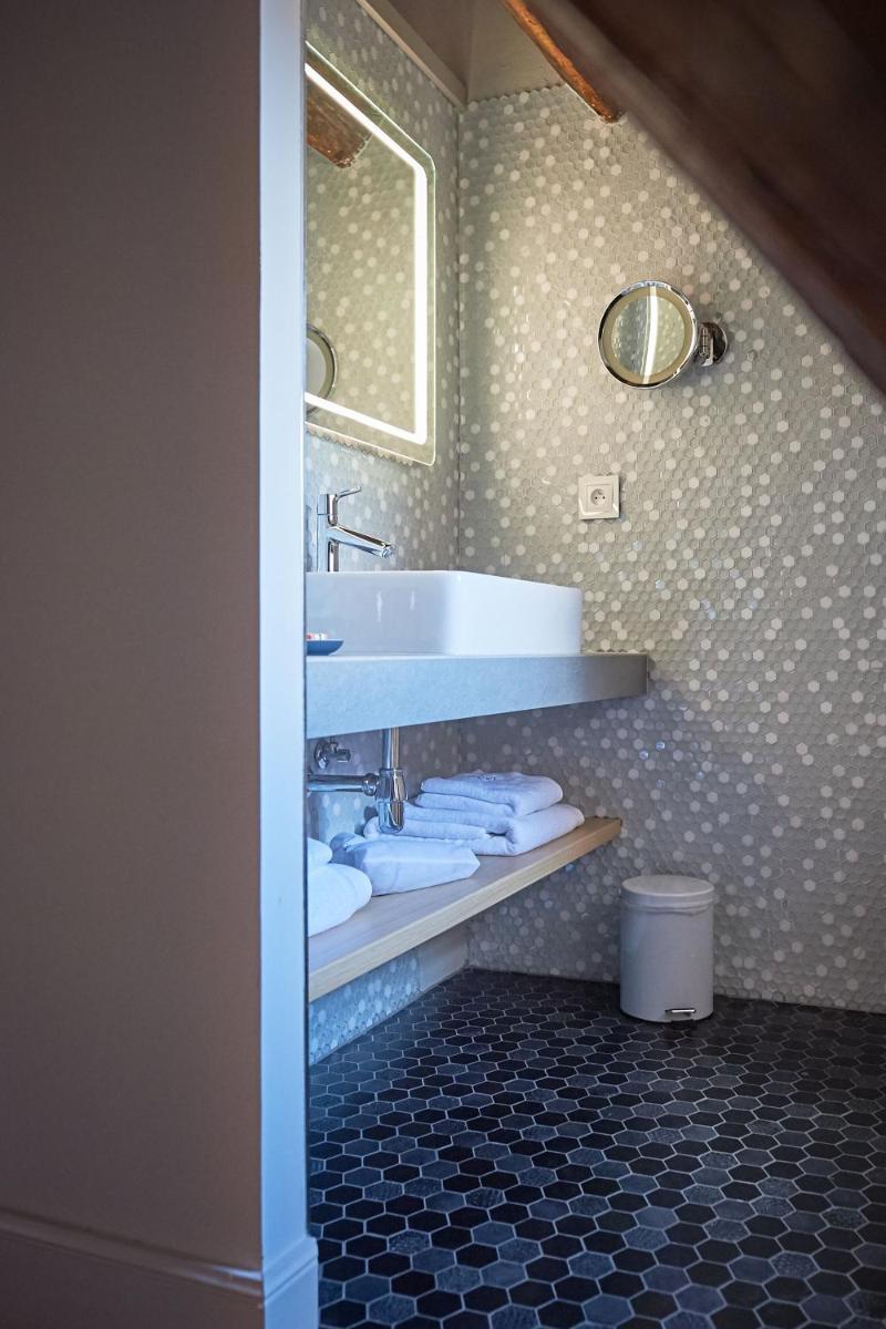 Salle de bains dans l'établissement Relais & Châteaux La Maison Des Têtes