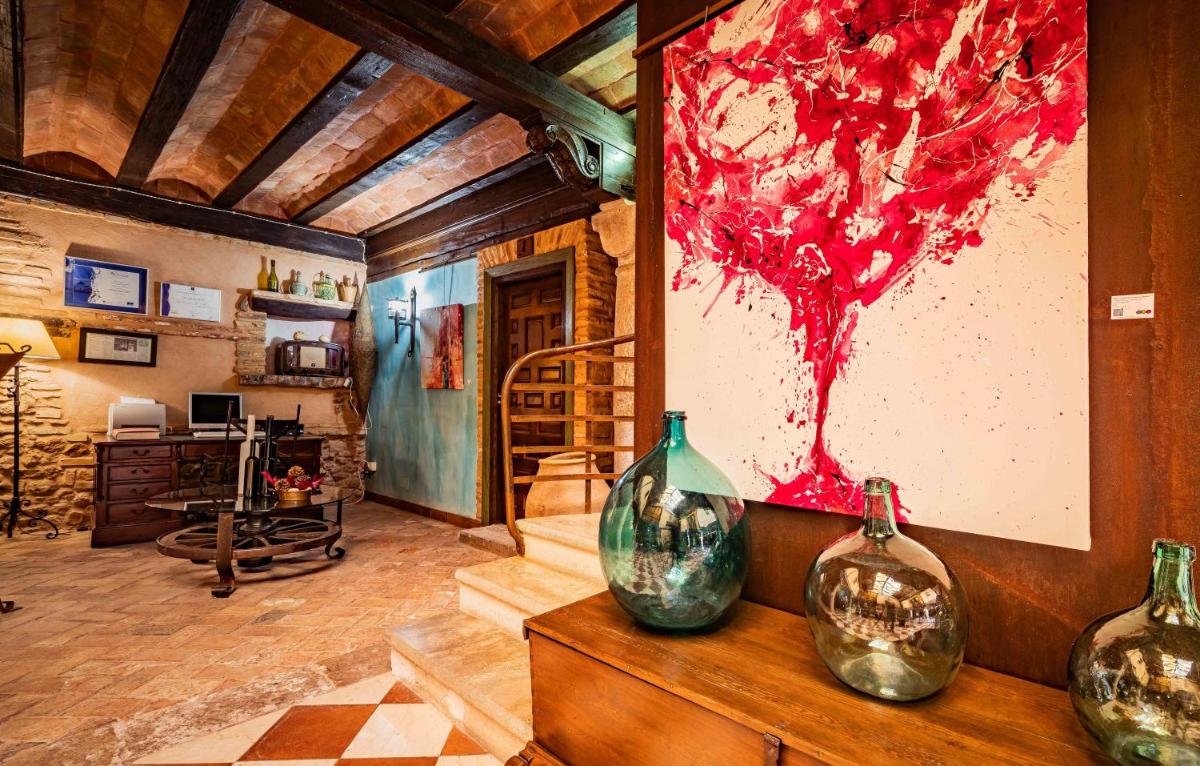 Una televisión o centro de entretenimiento en Hotel Spa La Casa del Rector Almagro