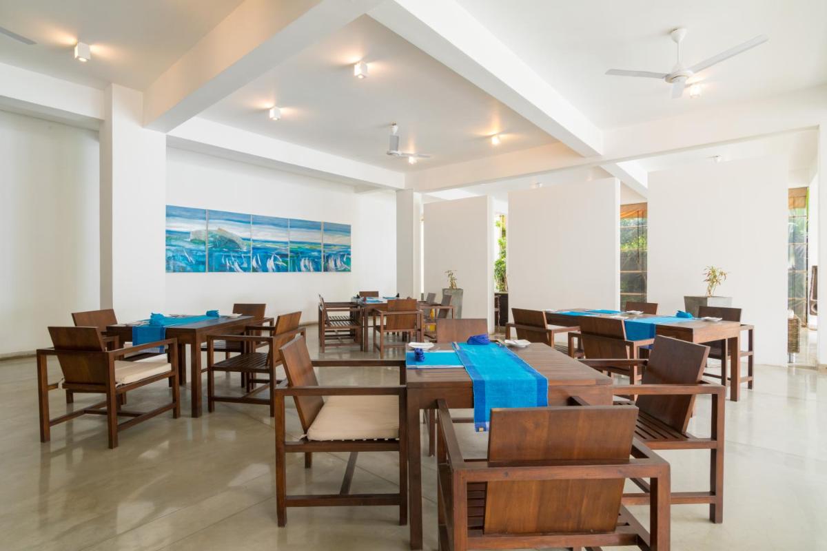 Roman Beach Hotel - Housity