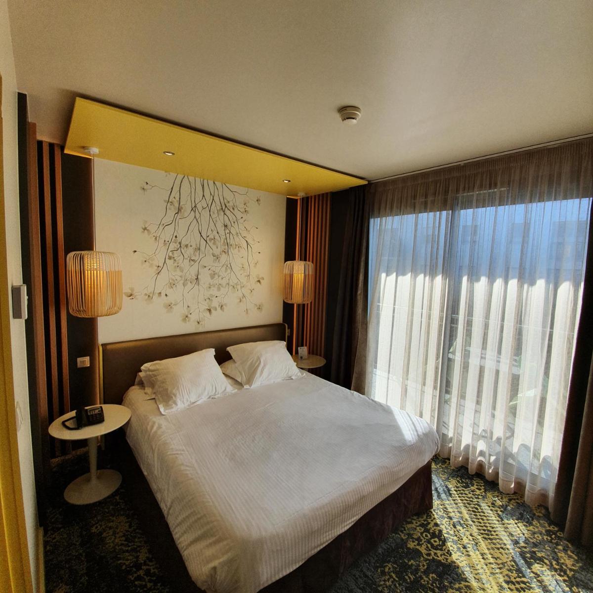 Un ou plusieurs lits dans un hébergement de l'établissement Best Western Aquakub
