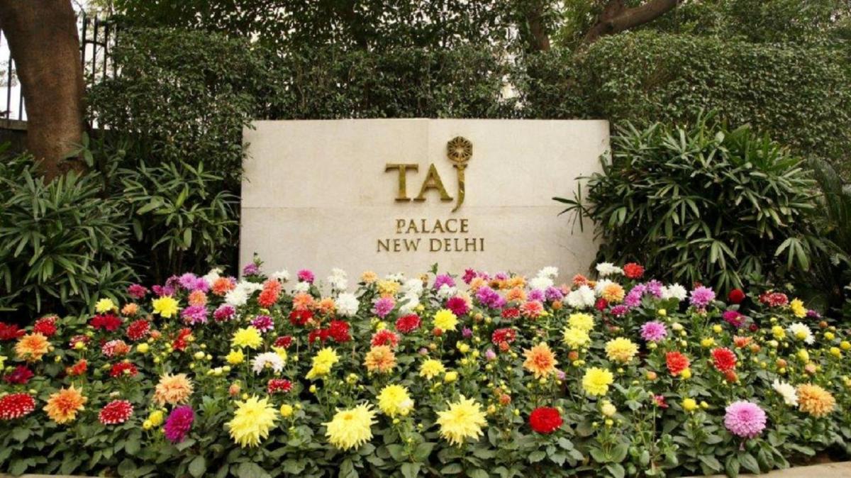 a display of colorful flowers in front of a sign at Taj Palace, New Delhi in New Delhi a display of colorful flowers in front of a sign at Taj Palace, New Delhi in New Delhi