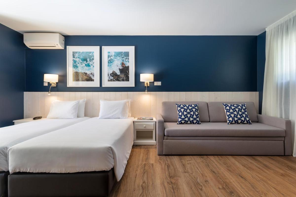 Uma cama ou camas num quarto em AP Adriana Beach Resort