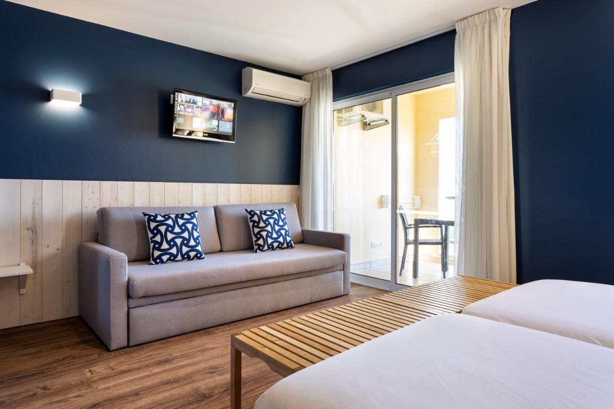 Uma cama ou camas num quarto em AP Adriana Beach Resort
