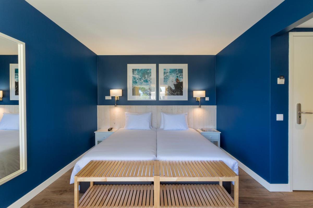 Uma cama ou camas num quarto em AP Adriana Beach Resort