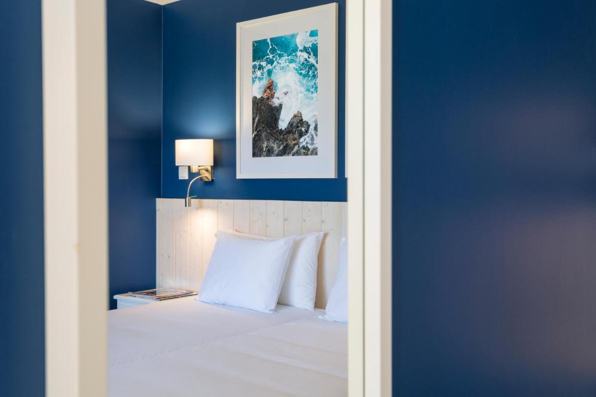 Uma cama ou camas num quarto em AP Adriana Beach Resort