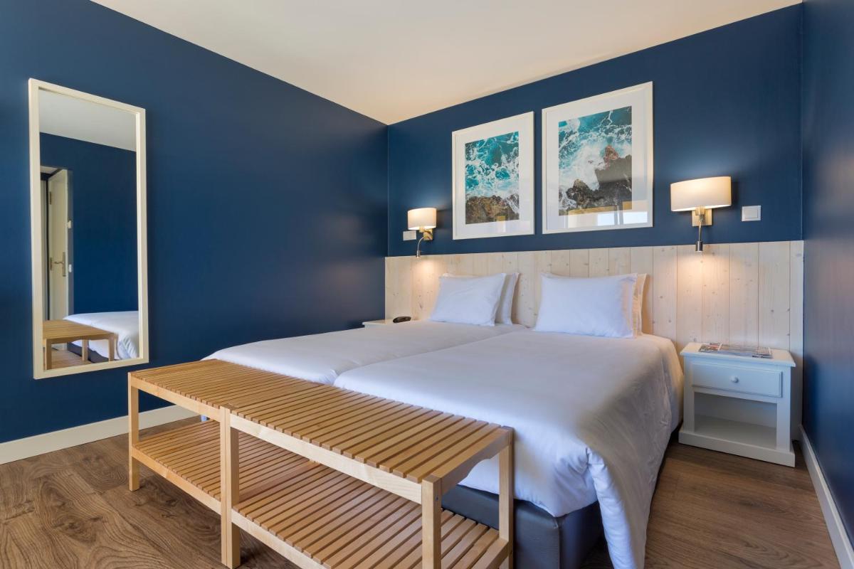 Uma cama ou camas num quarto em AP Adriana Beach Resort