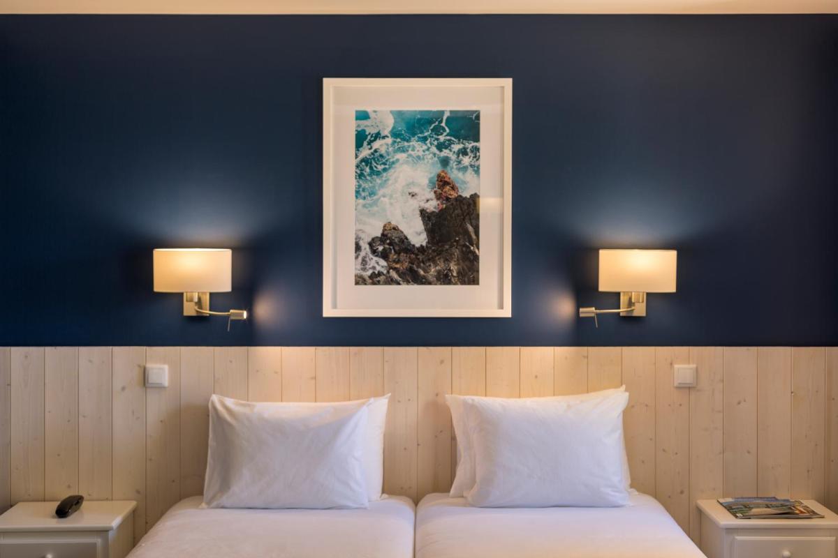 Uma cama ou camas num quarto em AP Adriana Beach Resort