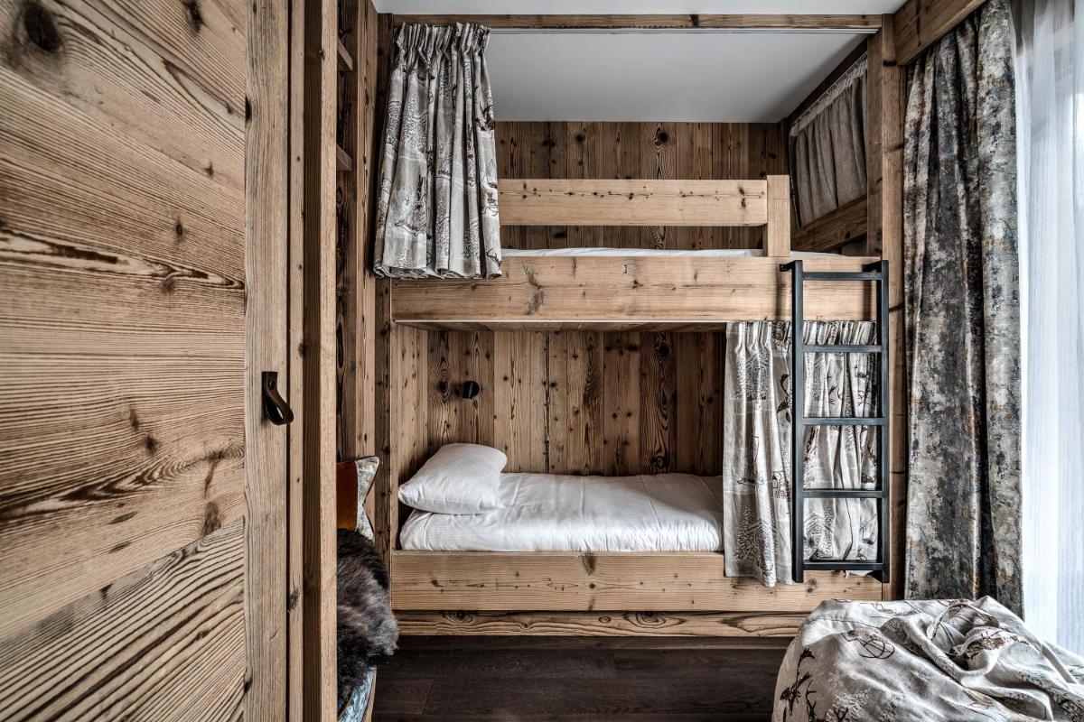 Un ou plusieurs lits dans un hébergement de l'établissement Hôtel La Sivolière