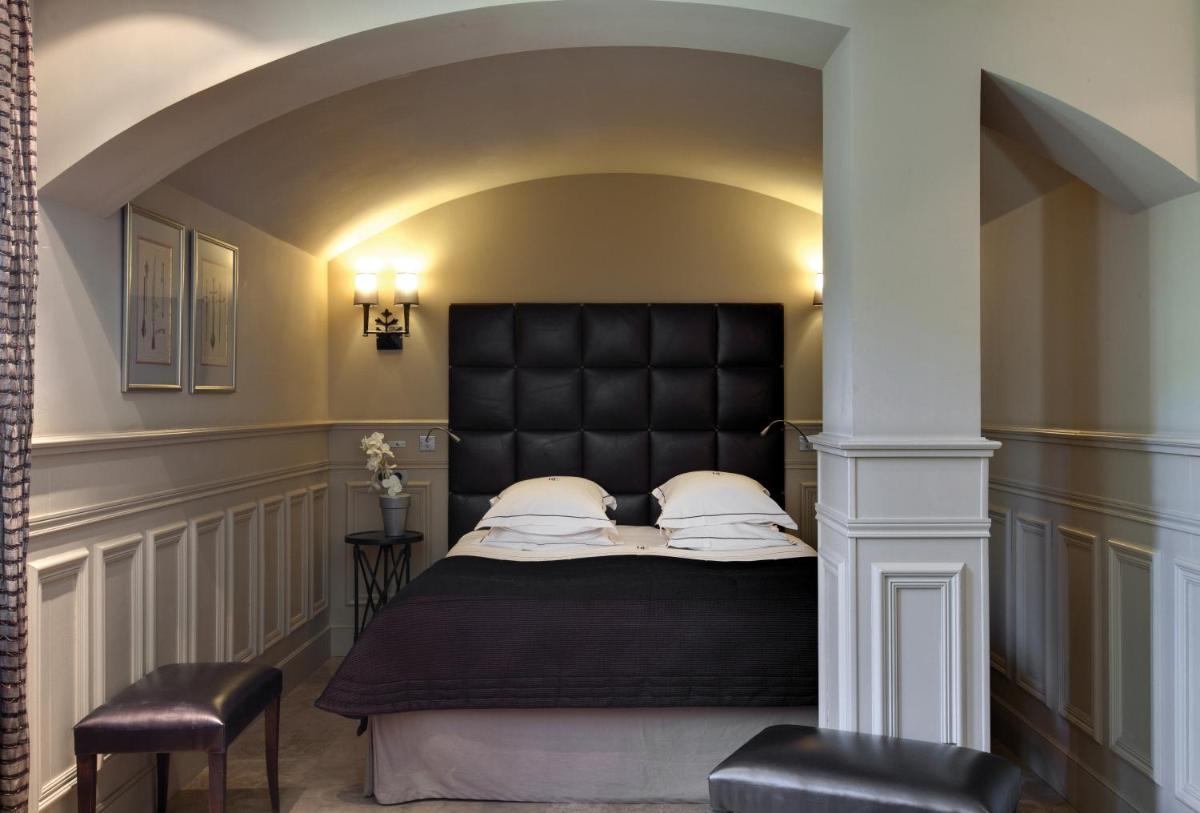 Un ou plusieurs lits dans un hébergement de l'établissement Hôtel du Château & Spa - Teritoria