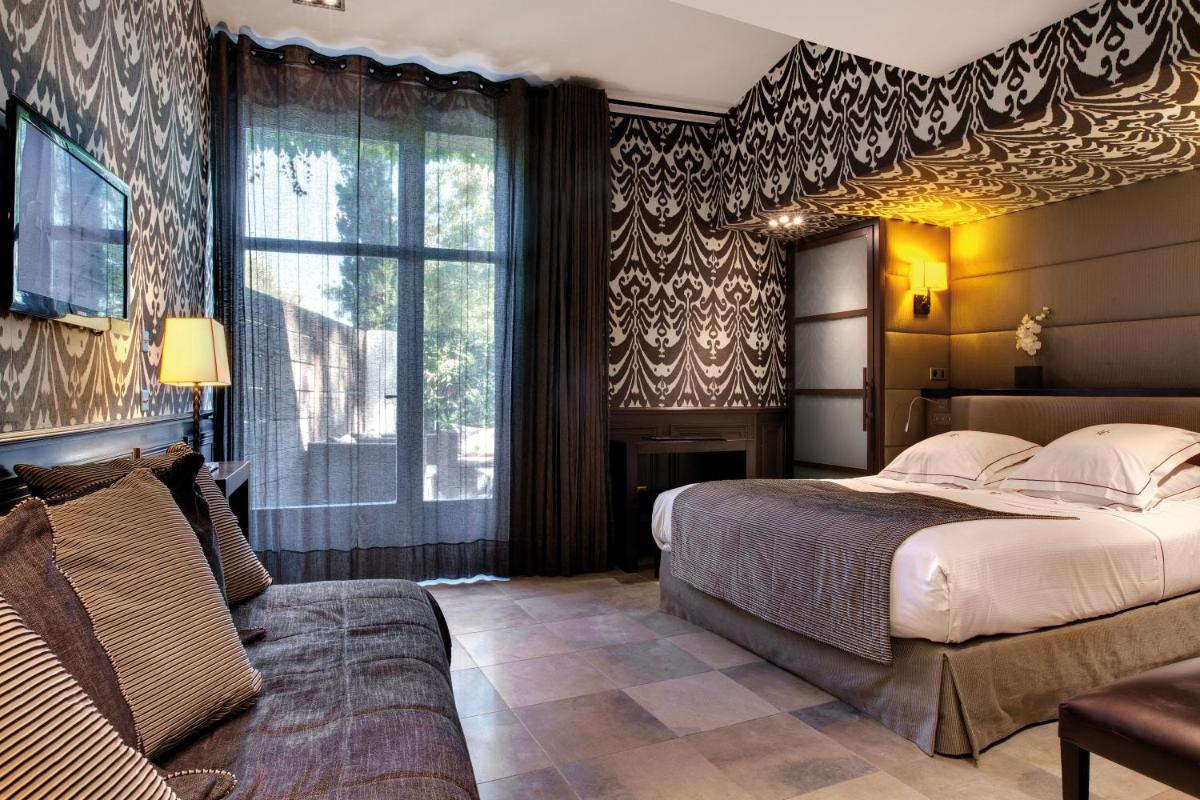 Un ou plusieurs lits dans un hébergement de l'établissement Hôtel du Château & Spa - Teritoria