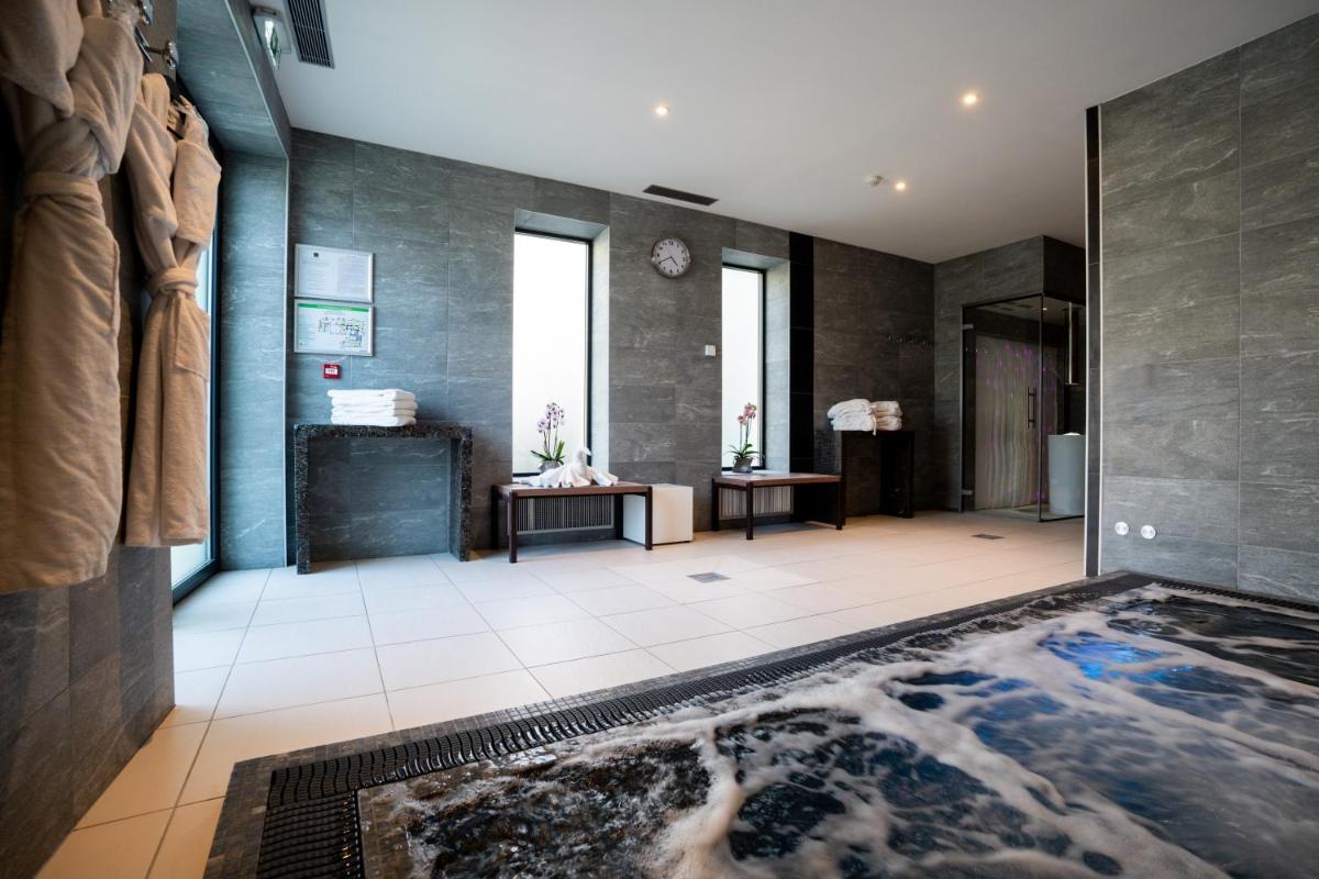 Un ou plusieurs lits dans un hébergement de l'établissement Fac & Spera -Hôtel & Spa