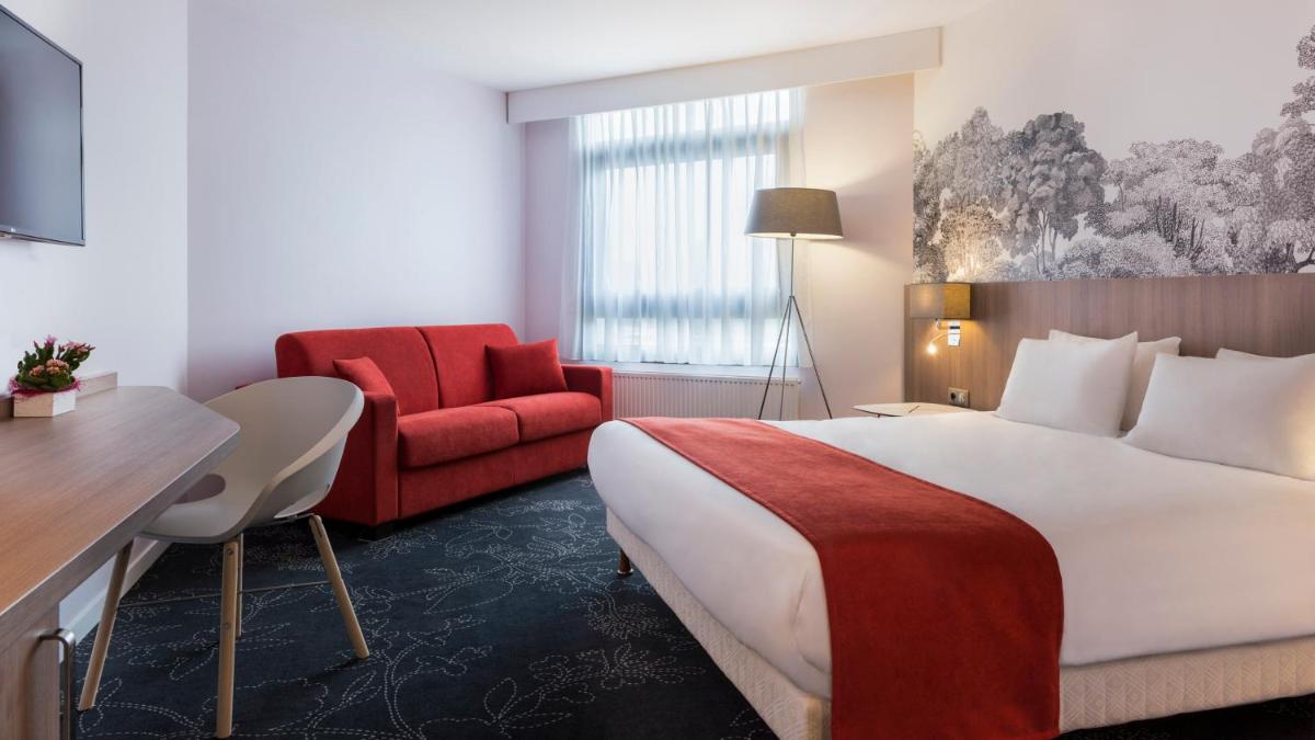 Un ou plusieurs lits dans un hébergement de l'établissement Holiday Inn Calais Coquelles by IHG