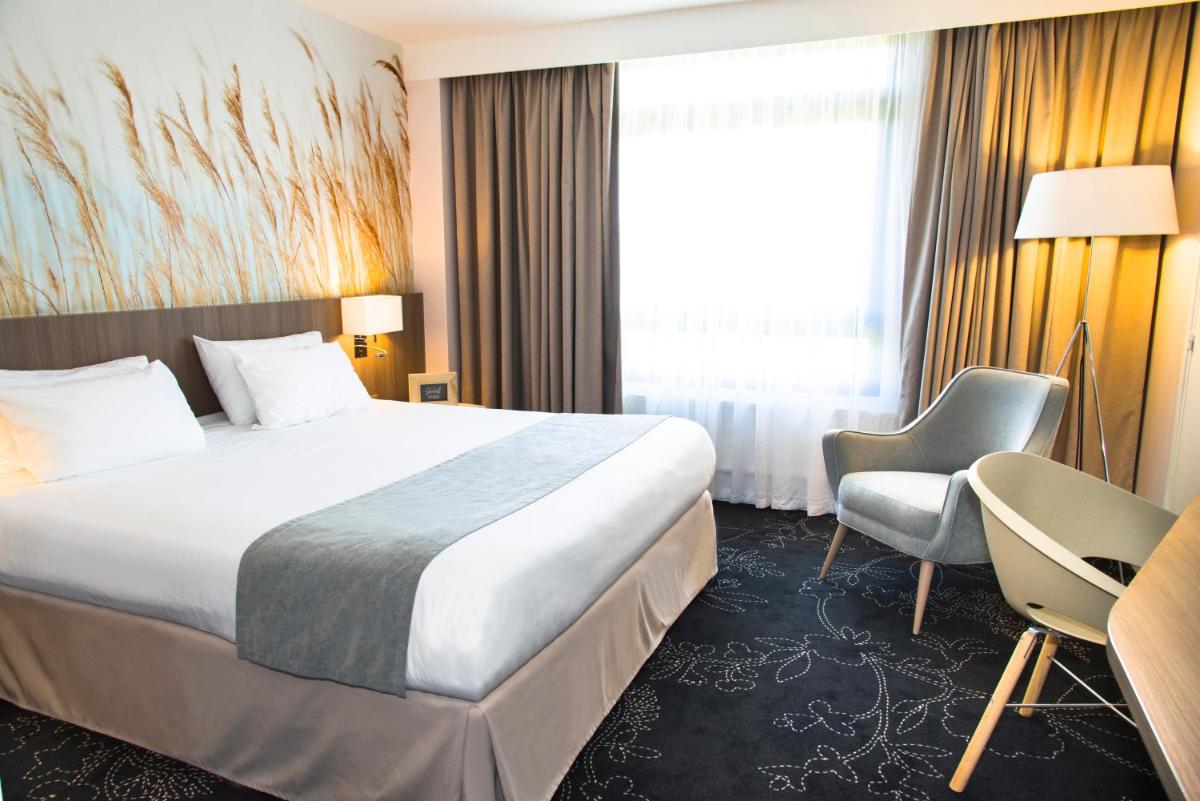 Un ou plusieurs lits dans un hébergement de l'établissement Holiday Inn Calais Coquelles by IHG