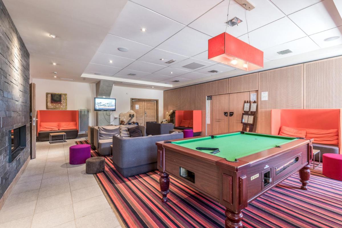 Coin salon dans l'établissement Résidence Pierre & Vacances Premium Les Terrasses d'Eos
