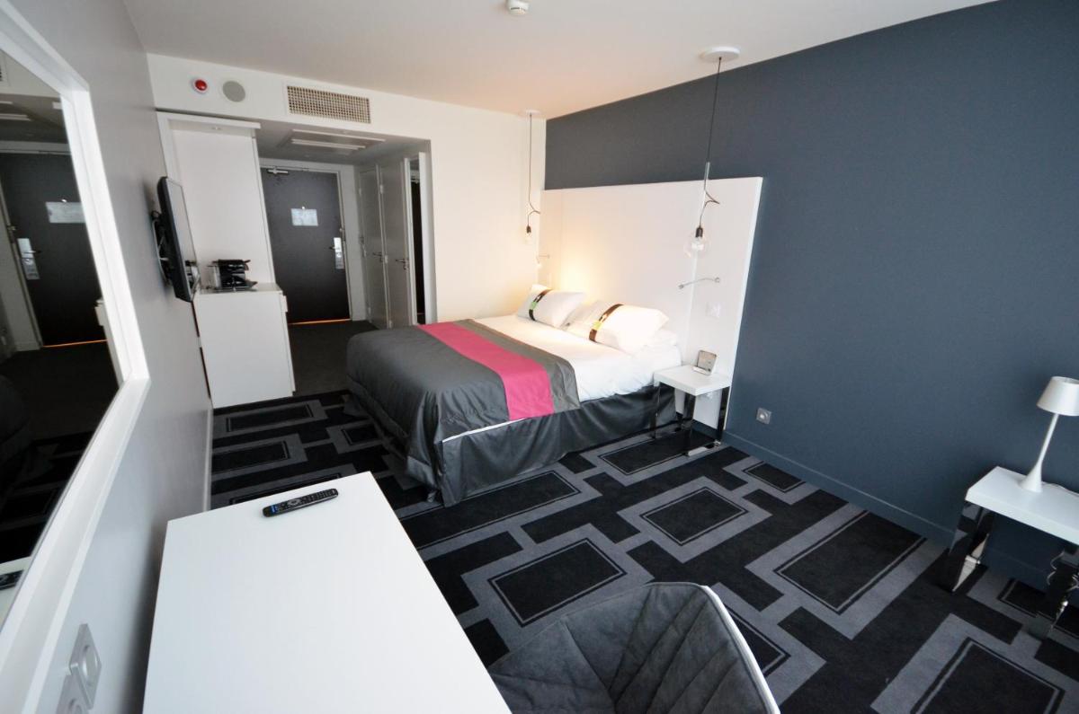 Un ou plusieurs lits dans un hébergement de l'établissement Holiday Inn Dijon Toison D'or by IHG