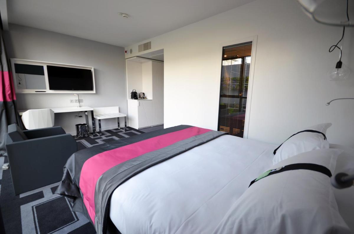 Un ou plusieurs lits dans un hébergement de l'établissement Holiday Inn Dijon Toison D'or by IHG