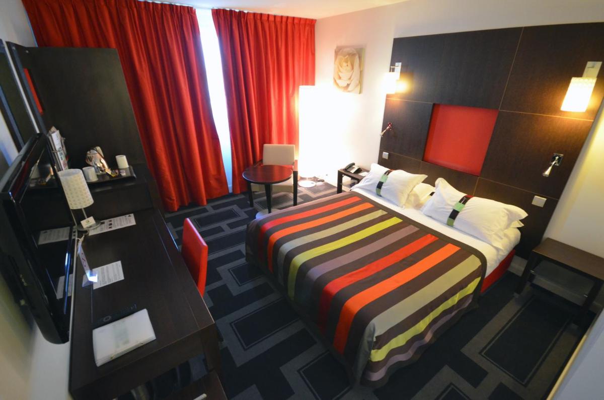 Un ou plusieurs lits dans un hébergement de l'établissement Holiday Inn Dijon Toison D'or by IHG