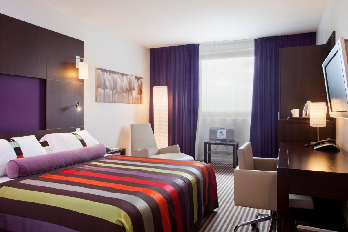 Un ou plusieurs lits dans un hébergement de l'établissement Holiday Inn Dijon Toison D'or by IHG