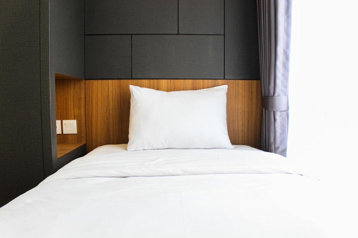 Warm and Cozy 3BR Apartment at M-Town Residence By Travelio - Housity