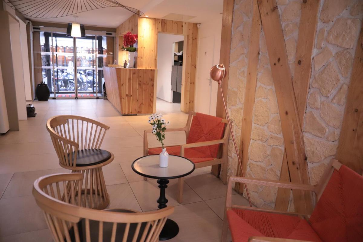 Coin salon dans l'établissement Hôtel Brésil Opéra SPA