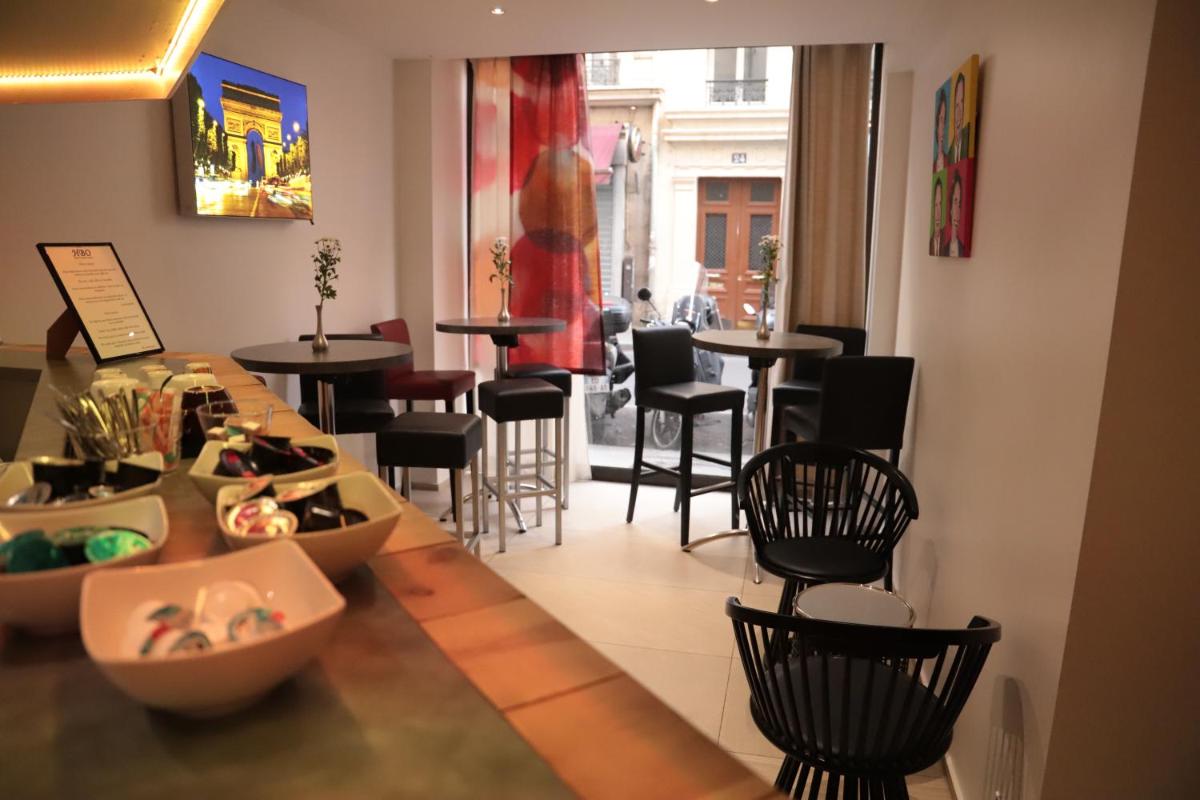 Coin salon dans l'établissement Hôtel Brésil Opéra SPA