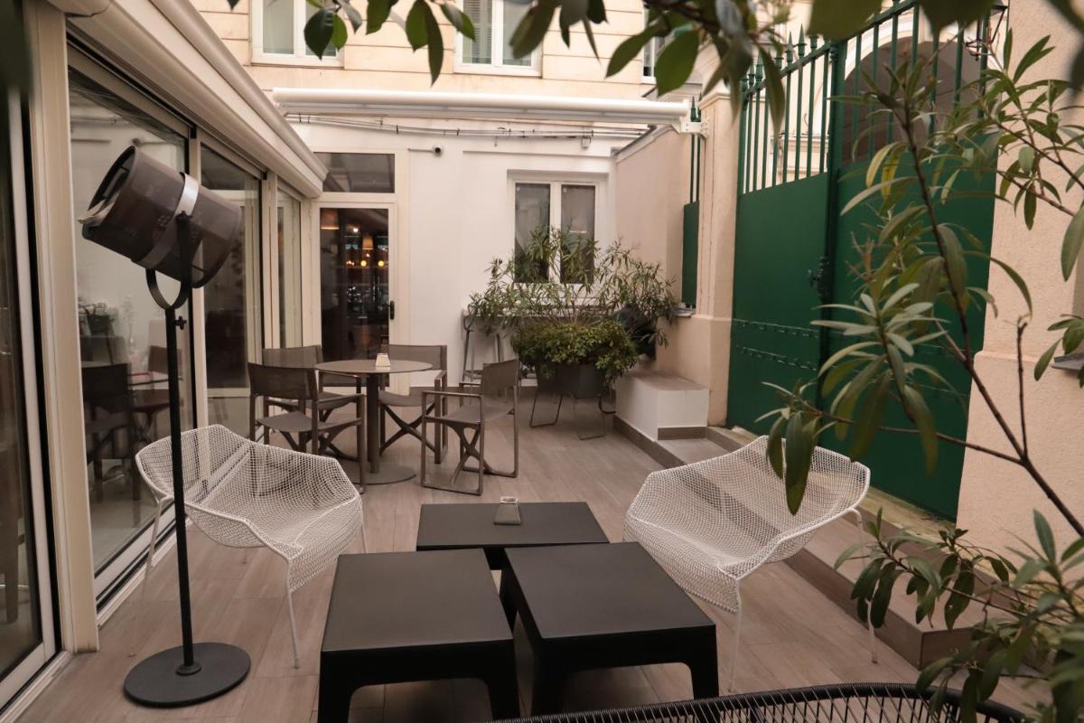 Coin salon dans l'établissement Hôtel Brésil Opéra SPA