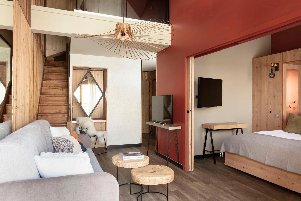 Un ou plusieurs lits dans un hébergement de l'établissement Grandes Rousses Hotel & Spa