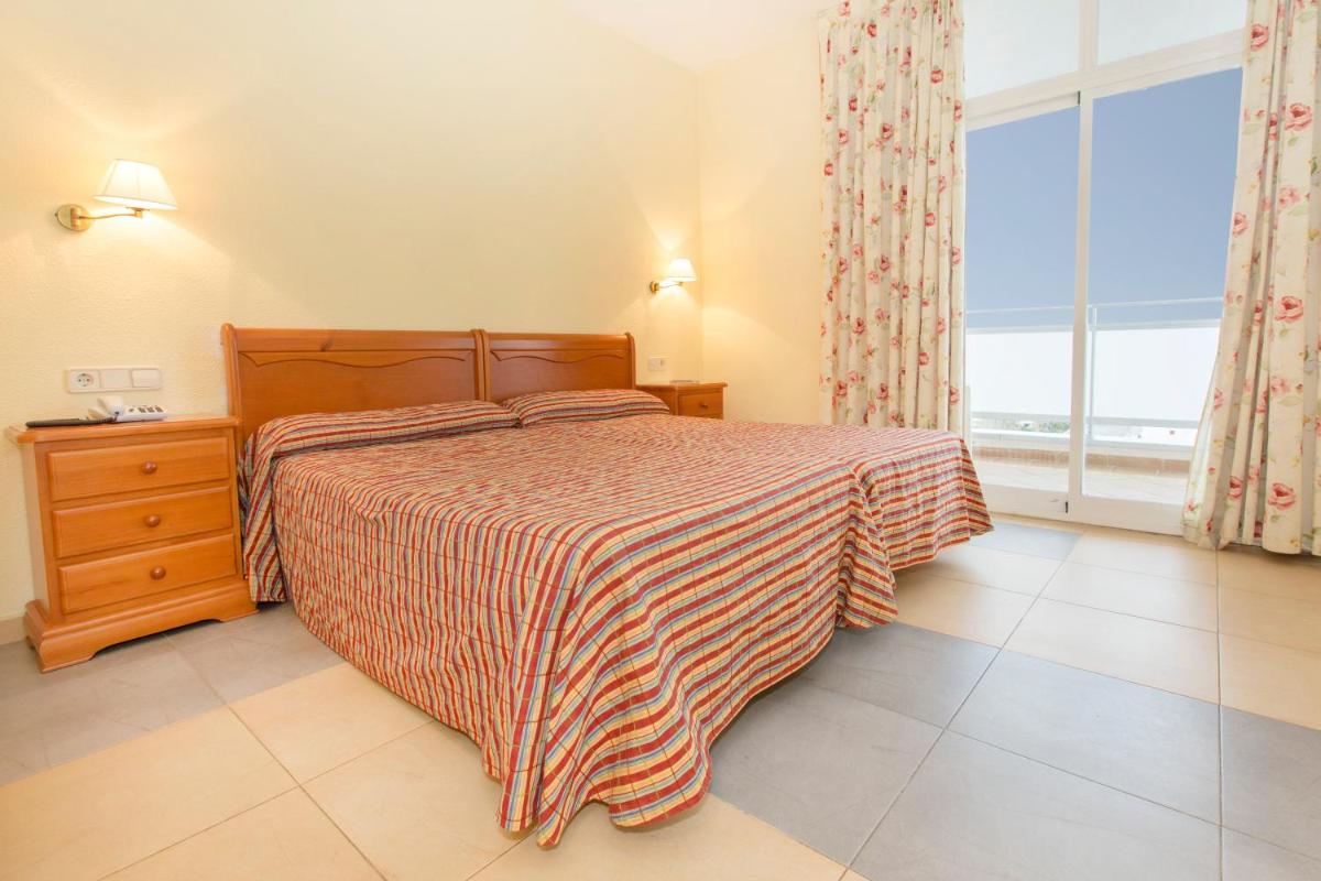 Cama o camas de una habitación en Hotel Tres Anclas