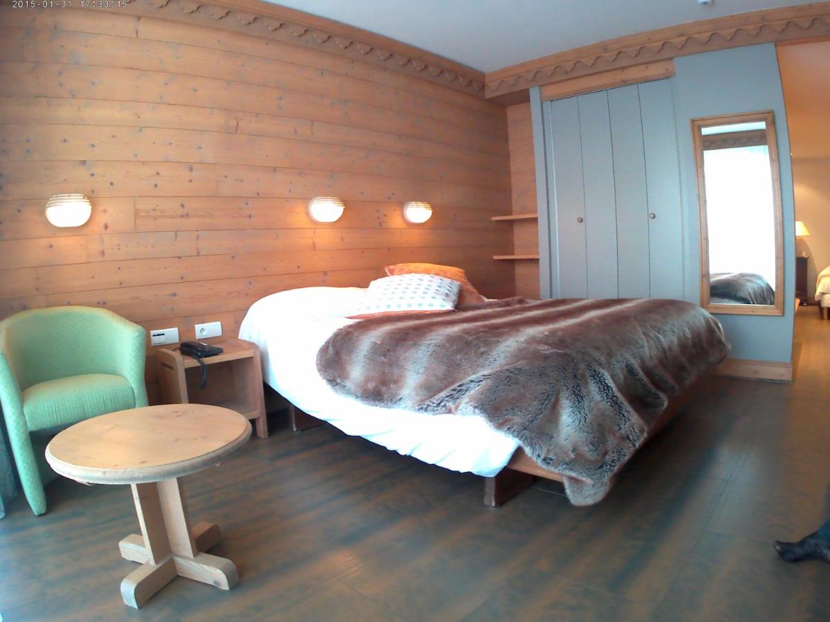 Un ou plusieurs lits dans un hébergement de l'établissement Hotel le Chalet