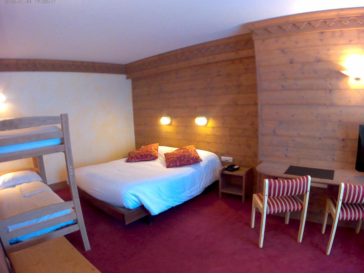 Un ou plusieurs lits dans un hébergement de l'établissement Hotel le Chalet