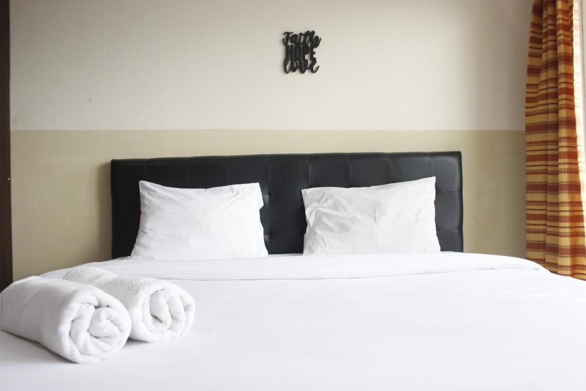 Suitetrails - Modern Studio Room at Tamansari La Grande Apartment By Travelio