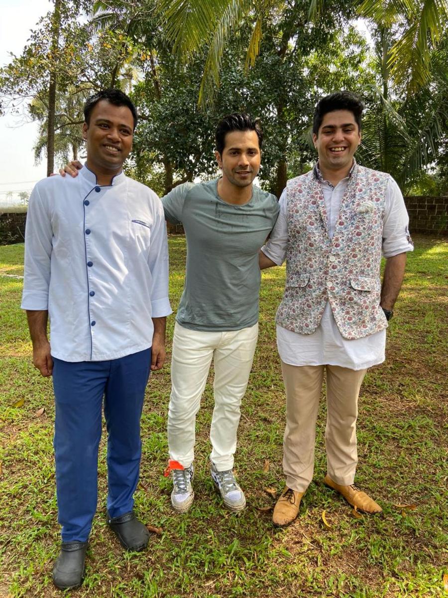 three men standing next to each other in a park at The Postcard Cuelim, Goa in Cansaulim
