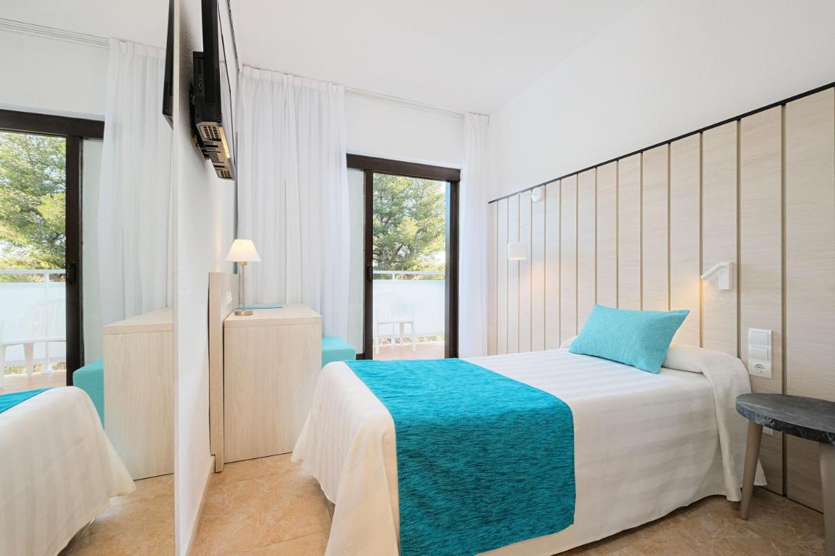 Cama o camas de una habitación en azuLine Hotel Bergantin