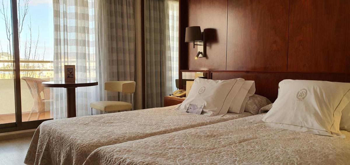 Cama o camas de una habitación en Hotel Royal Plaza