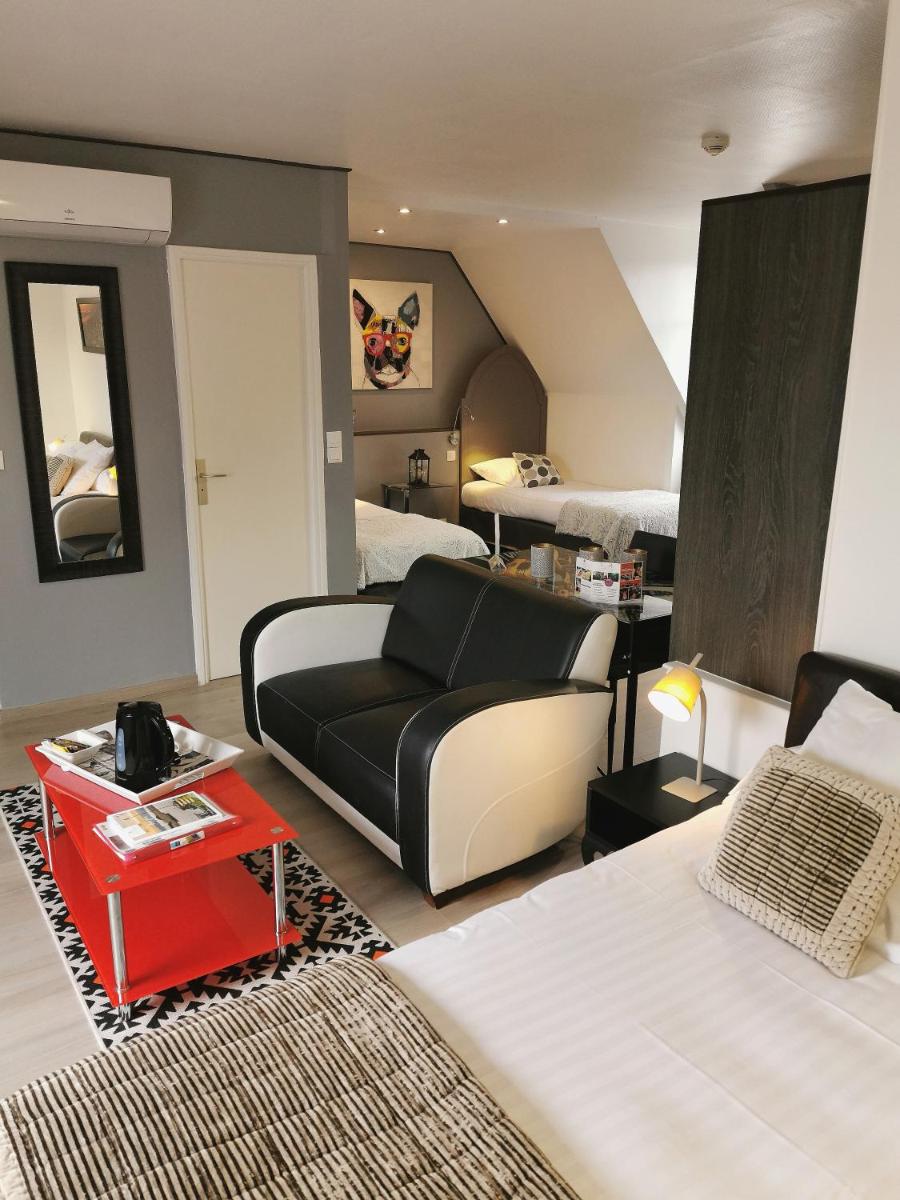 Un ou plusieurs lits dans un hébergement de l'établissement Les Terrasses de Saumur - Hôtel & Appartements - Restaurant & Spa (Logis)